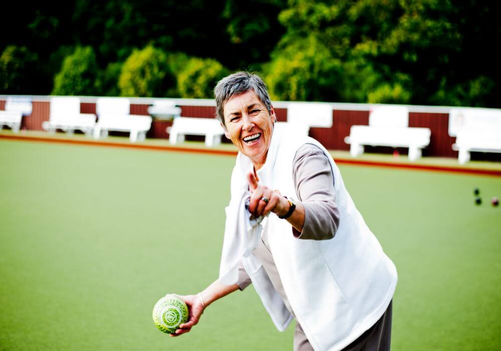 Woman playing lawn bowls 